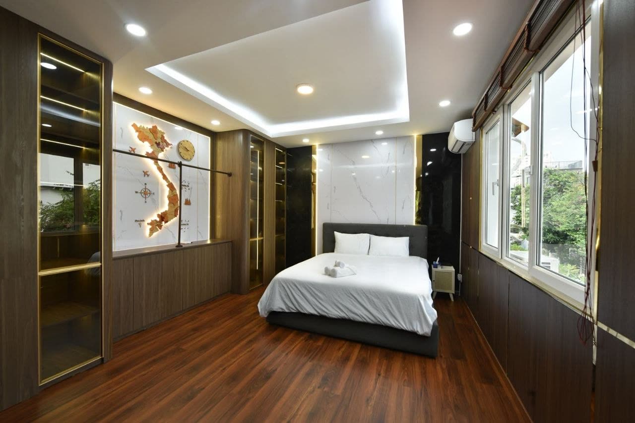 Master 1, dark wood panelling and a king bed