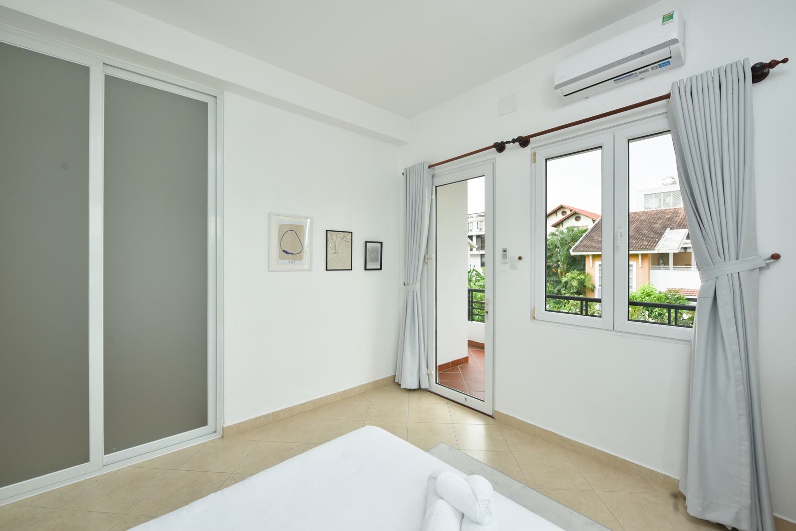 Room with air conditioning and sliding glass doors onto the balcony
